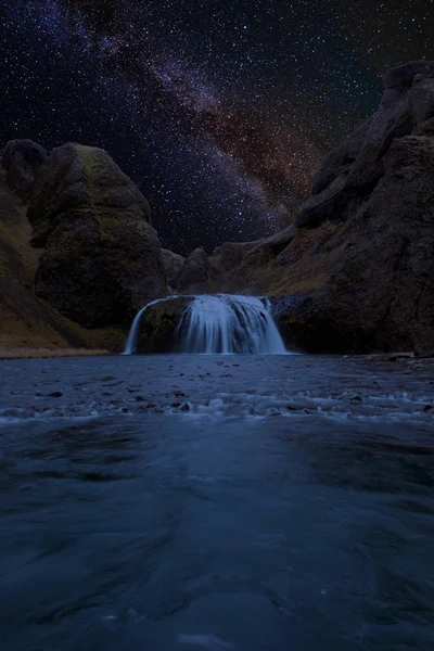 Milkyway at a waterfall in Iceland — Stock Photo, Image