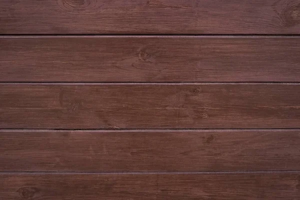 Klassisch brauner Holzhintergrund aus dunklem Naturholz im Stil des Grunge. Ansicht von oben. roh gehobelte Textur von Nadelkiefern lackiert. die Oberfläche des Tisches zum Schießen lag flach. Kopierraum — Stockfoto