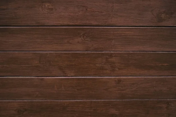 Fondo de madera marrón clásico hecho de madera natural oscura en el estilo de grunge. Vista superior. Textura cepillada cruda de pino conífero barnizado. La superficie de la mesa para disparar plano laico. Copiar espacio —  Fotos de Stock