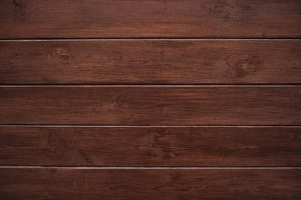 Fondo de madera marrón clásico hecho de madera natural oscura en el estilo de grunge. Vista superior. Textura cepillada cruda de pino conífero barnizado. La superficie de la mesa para disparar plano laico. Copiar espacio —  Fotos de Stock