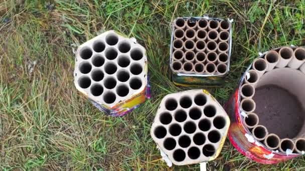 Used burnt fireworks, firecrackers lie on ground after the explosion in holiday. Birthday, new year and Christmas celebrations. Dangerous explosives. Safety measures when using pyrotechnics. — Stock Video