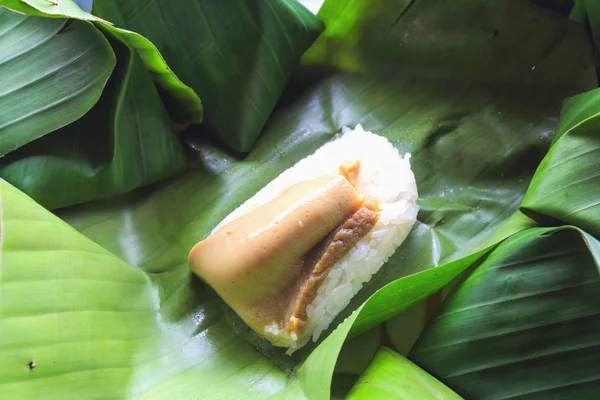 Thai dessert, Sticky rice with steamed custard, wrapped in banan — Stock Photo, Image