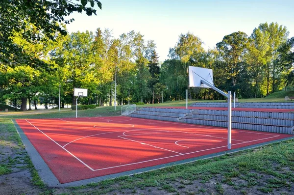 Basketball court over the lake. Place of recreation and leisure.