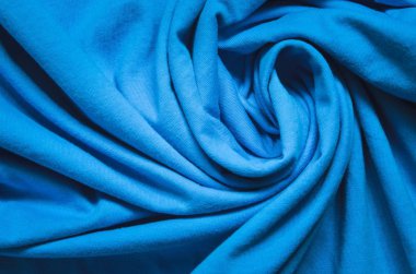 İlginç bir giyim geçmişi var. Kırışık maddenin mavi dokusu.