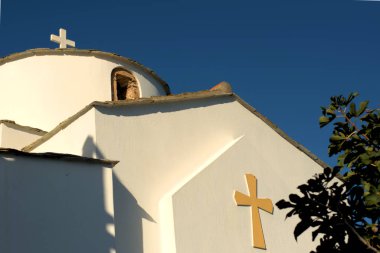 Greece Skopelos island,Panagitsa toy Pyrgou (Holy Mary of the Castle) is the small church you can see when entering thw port of Skopelos . clipart