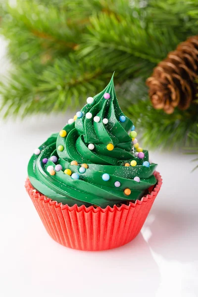 Christmas green cupcake in red cup — Stock Photo, Image