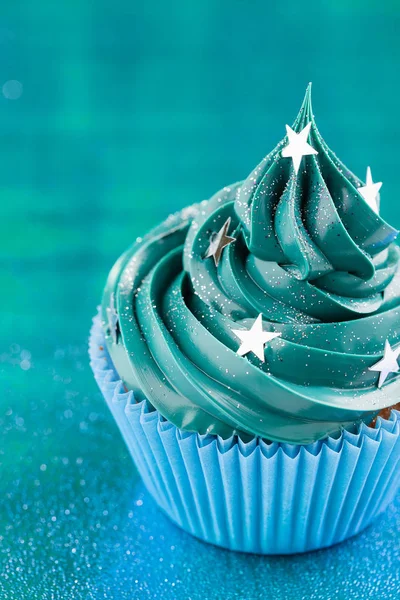 Blue cupcake with stars glitter sprinkles — Stock Photo, Image