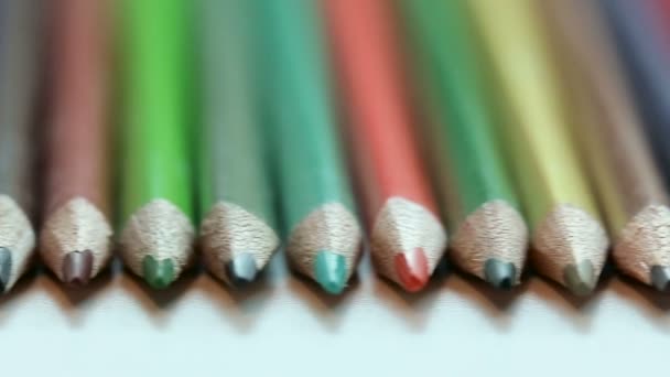 Color pencils on white table — Stock Video