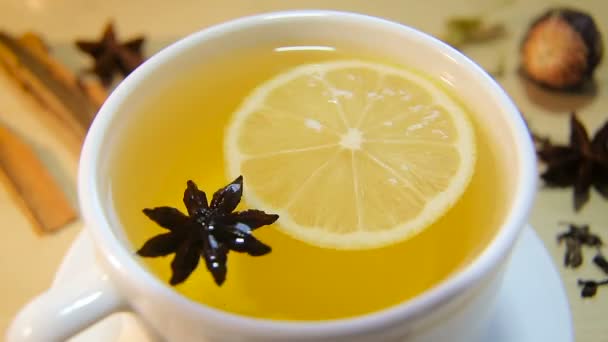 Cup of tea with lemon and anise — Stock Video