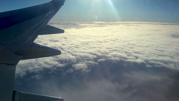 Clouds and sky as seen through the window of an aircraft — Stock Video