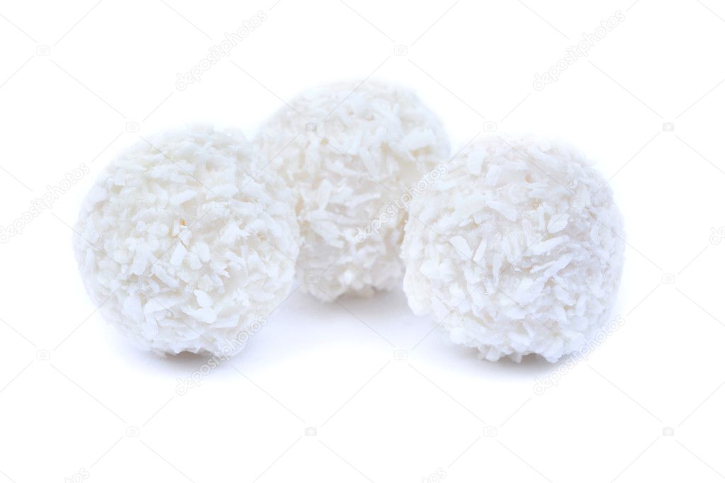 Three coconut cookies on white bacground