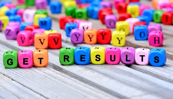 The colorful words Get Results on table