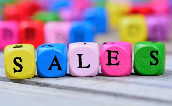 Sales word on wooden table — Stock Photo, Image