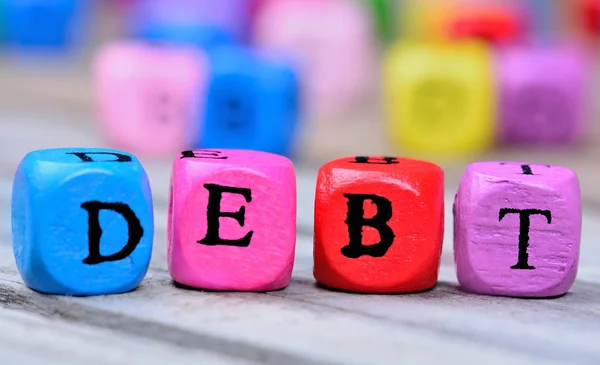 Parola di debito sul tavolo di legno — Foto Stock