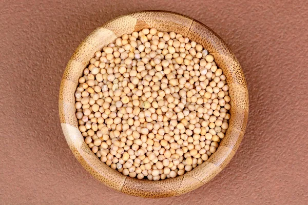 Mustard seeds in a bamboo bowl — Stock Photo, Image