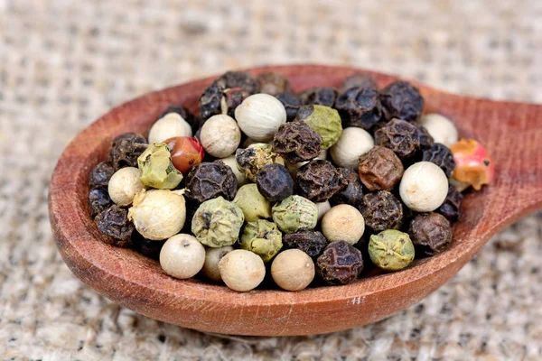 Colorful peppercorns in a spoon — Stock Photo, Image