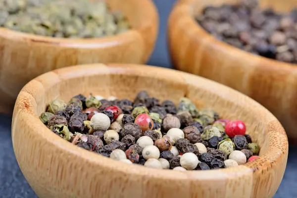 Peppercorns in a bamboo bowls