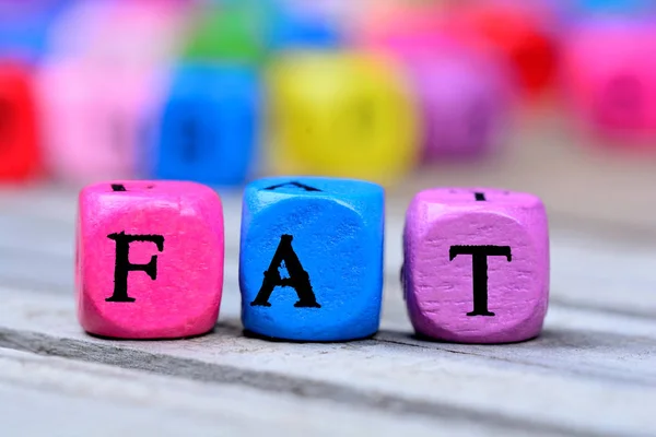 Fat word on table — Stock Photo, Image