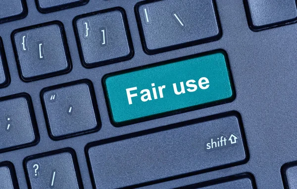 Fair use words on computer keyboard