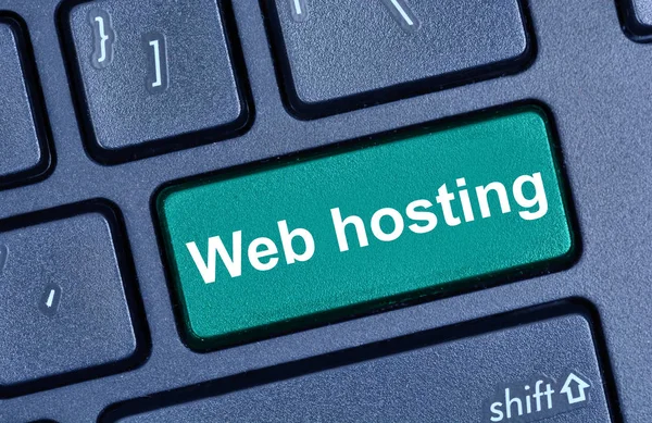 Web hosting words on computer keyboard — Stock Photo, Image