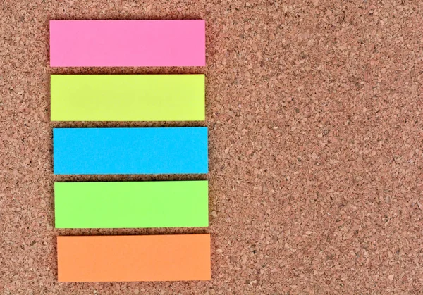 Empty colorful notes on cork background — Stock Photo, Image