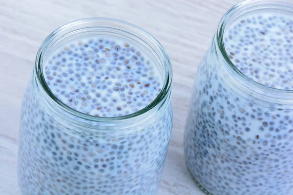 Chia seeds pudding in glass jar on table — Stock Photo, Image