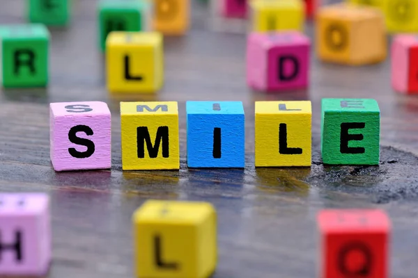 Smile word on table — Stock Photo, Image
