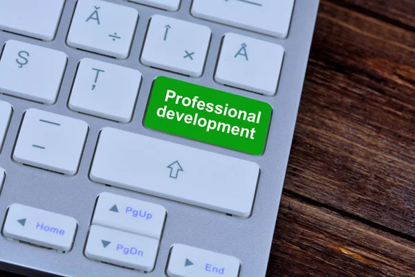 Desenvolvimento profissional no botão teclado — Fotografia de Stock