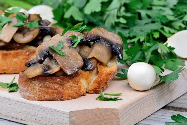 Mushroom bruschetta on table — Stock Photo, Image