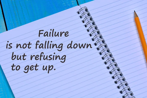 Failure is not falling down but refusing to get up text on notebook — Stock Photo, Image
