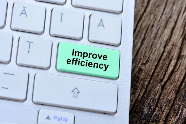 The words Improve efficiency on computer keyboard button — Stock Photo, Image