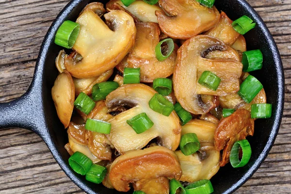 Champignon in a pan on table — Stock Photo, Image