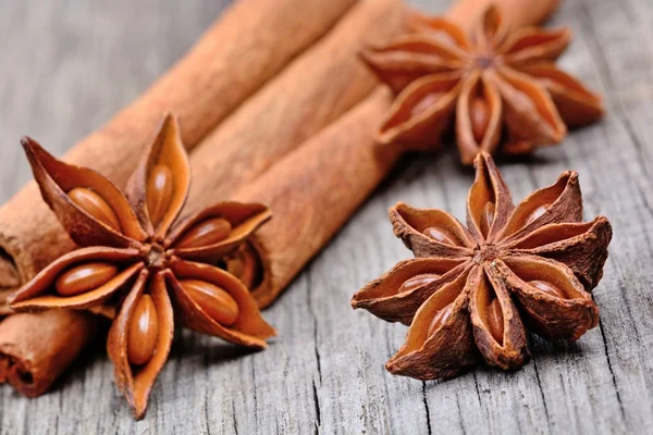 Star anise with cinnamon on wooden table Royalty Free Stock Images