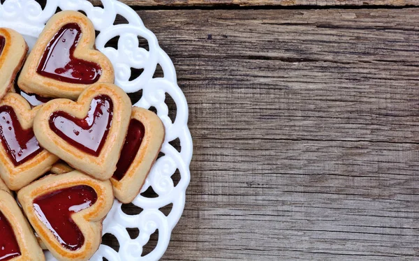 Heap of heart cookies in a plate on table