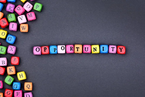 The word Opportunity on black background — Stock Photo, Image