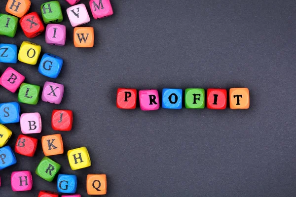 The word Profit on black background — Stock Photo, Image
