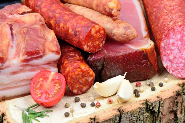 Variety types of sausages on a wood board Stock Photo