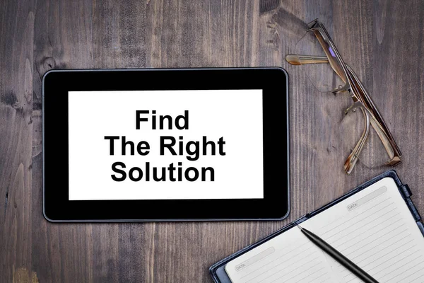 Find the right solution. Text on tablet device on desk — Stock Photo, Image