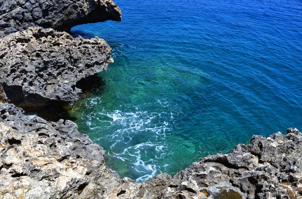 The coast of the Mediterranean Sea and the purest azure sea, a bright sunny day. Beautiful seascape. Marine background