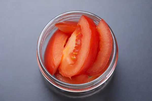 Fresh tomatoes in a jar — Stock Photo, Image