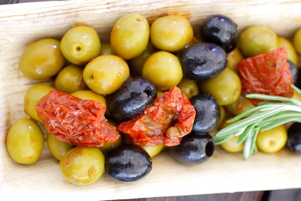 black and green olives, herbs, sun-dried tomatoes