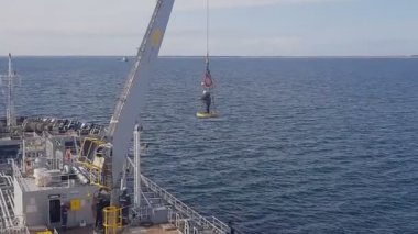 videographer performs video shooting standing in basket