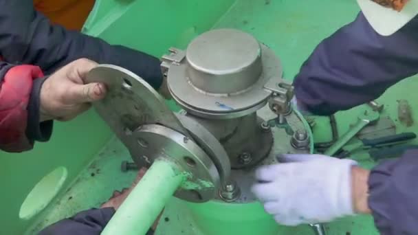 Repairmen repair stationary tank washer fixing valve parts — Stockvideo