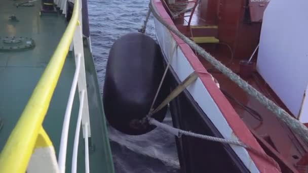 Mooring fender between oil tanker and client ship closeup — Stockvideo
