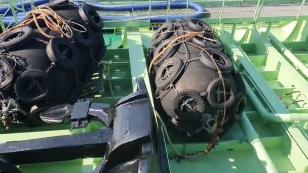 Huge mooring fenders lie on green tanker deck closeup — Stok video