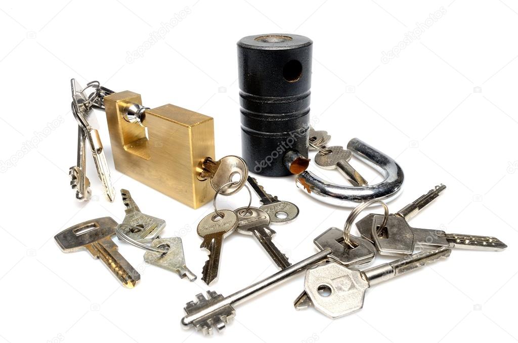 objects on white background variety of metal keys and locks