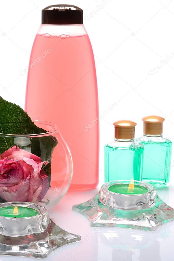 Objects body care on a white background shampoos, rose flower, candle