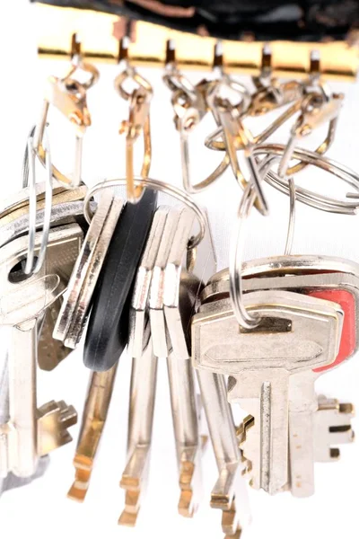 Many Objects Metal Keys Hang Attached Rings White Background — Stock Photo, Image