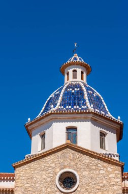 Altea, a town of the white coast, a tourist destination in Spain. The Virgin of the Consul, this is the main church of Altea, is the best known of the Costa Blanca for its two domes of blue enamelled ceramic tiles. clipart