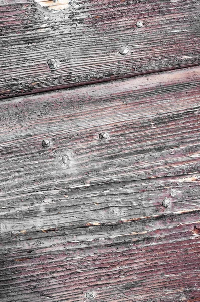 Wood panels of an ancient house, Italy. Walls and ornaments in painted wood for the country house, ruined by time.